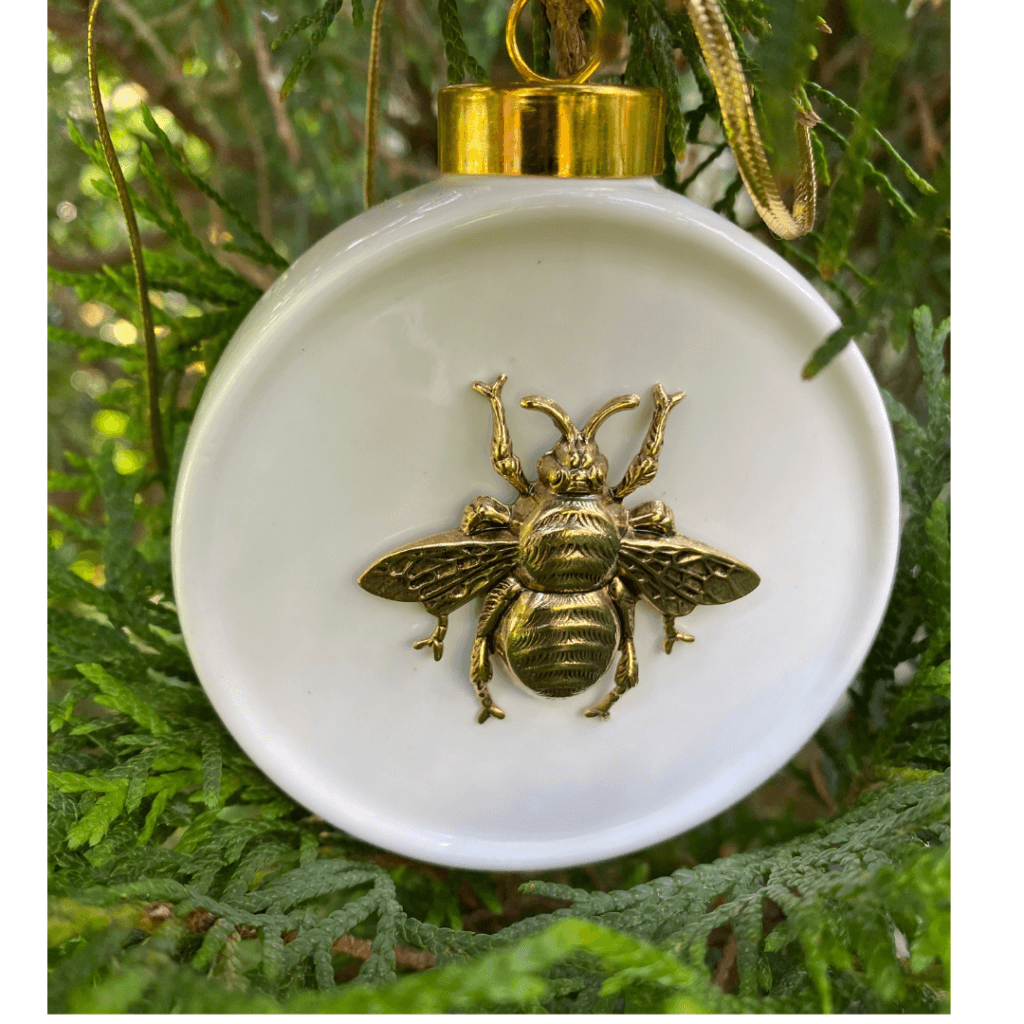 White China Christmas ornament with large gold bee.